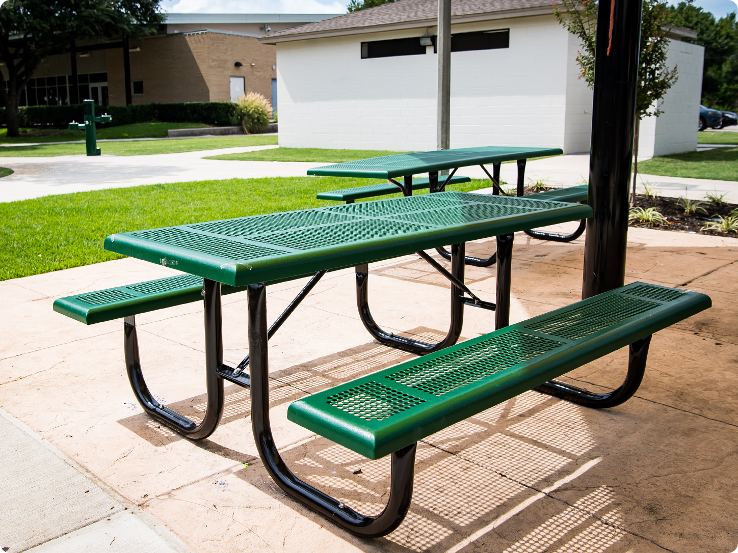 Well-maintained thermoplastic picnic table in a commercial park setting